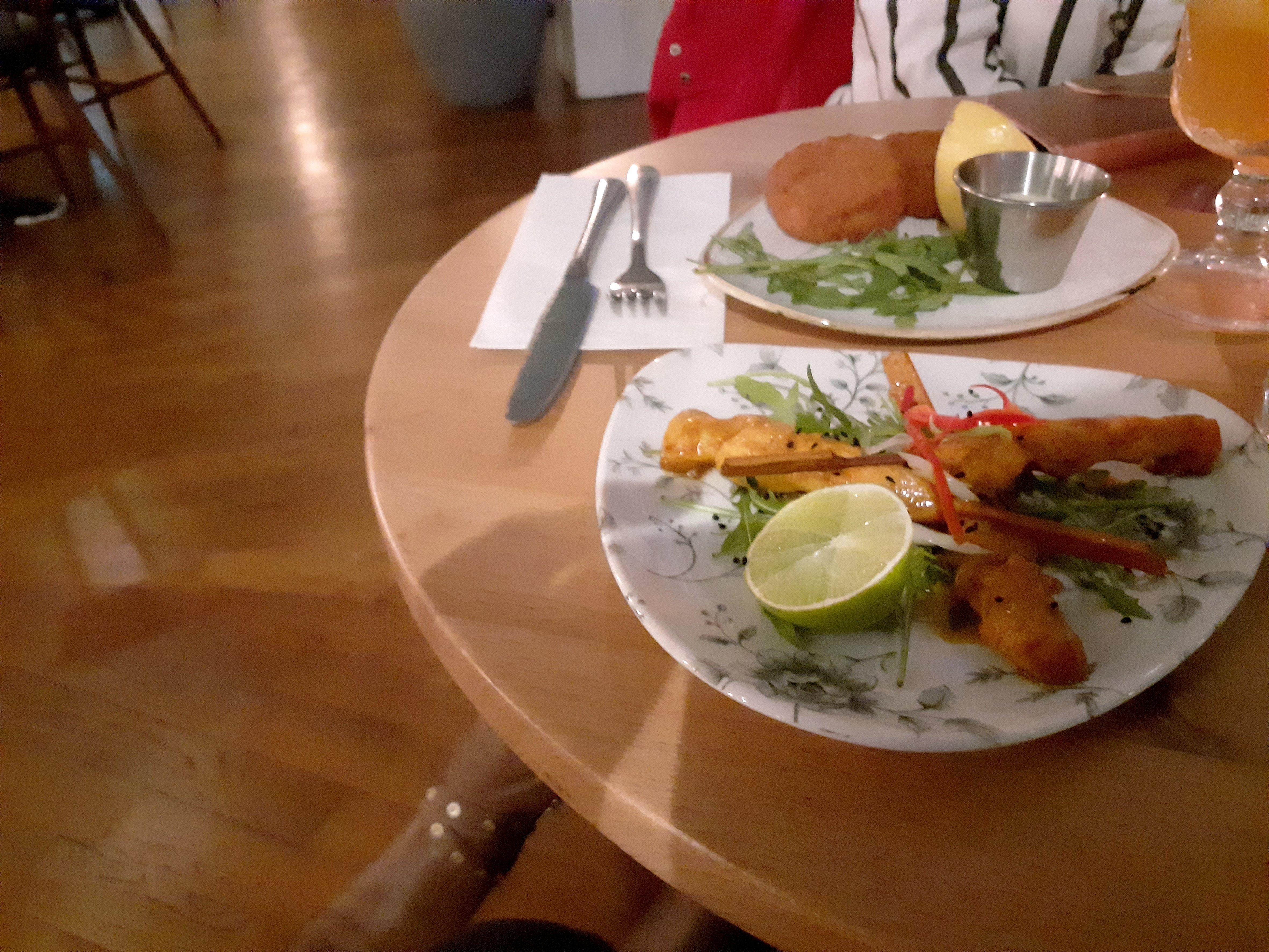 Starters of katsu chicken skewers and salmon fishcakes.