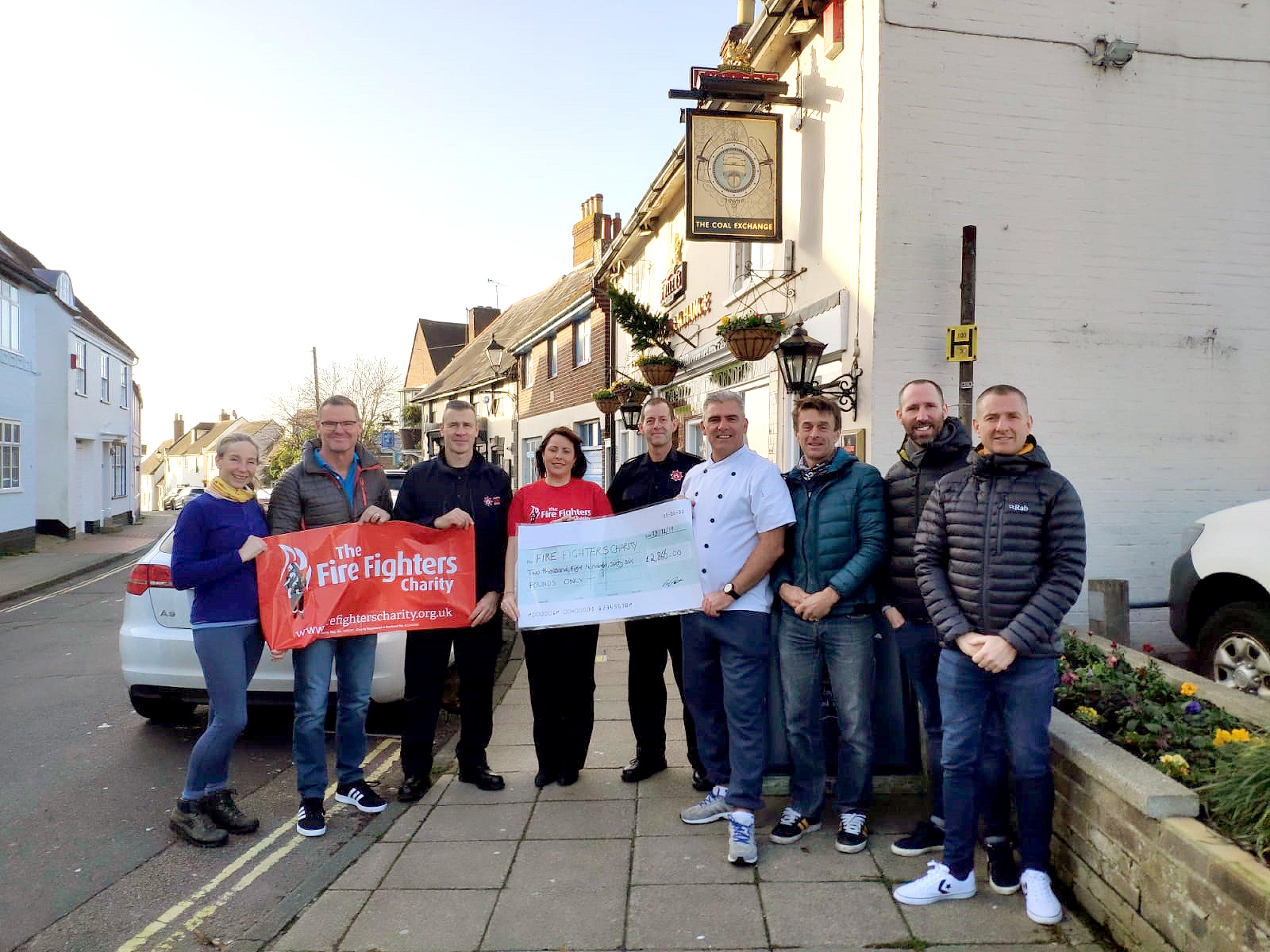 Coalie Crawlers took on a 7.5km swim from Hayling Island to Emsworth to raise thousands for the Fire Fighters Charity and presented a cheque to regional fundraiser Kerry James