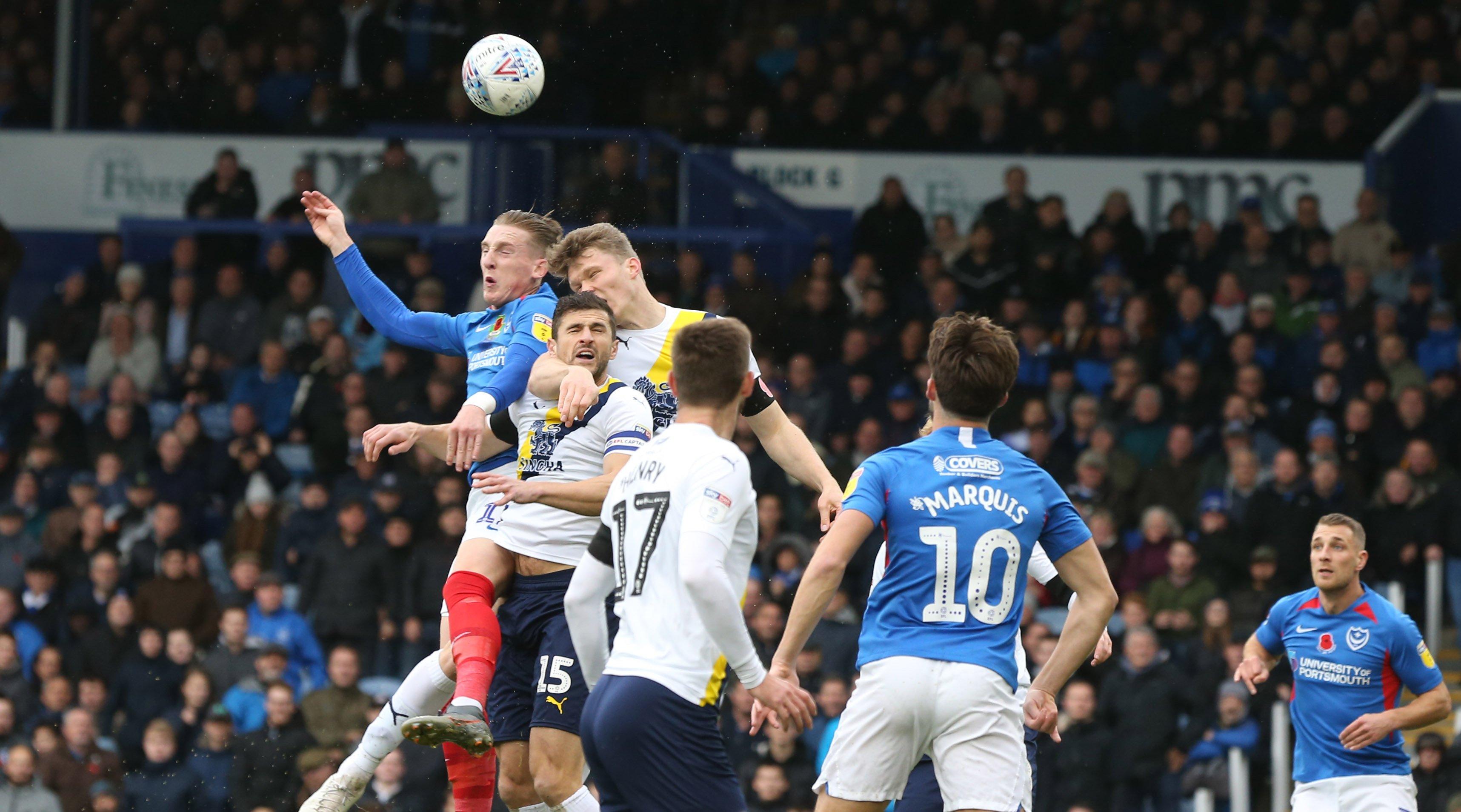 Portsmouth's Ronan Curtis battles for the ball