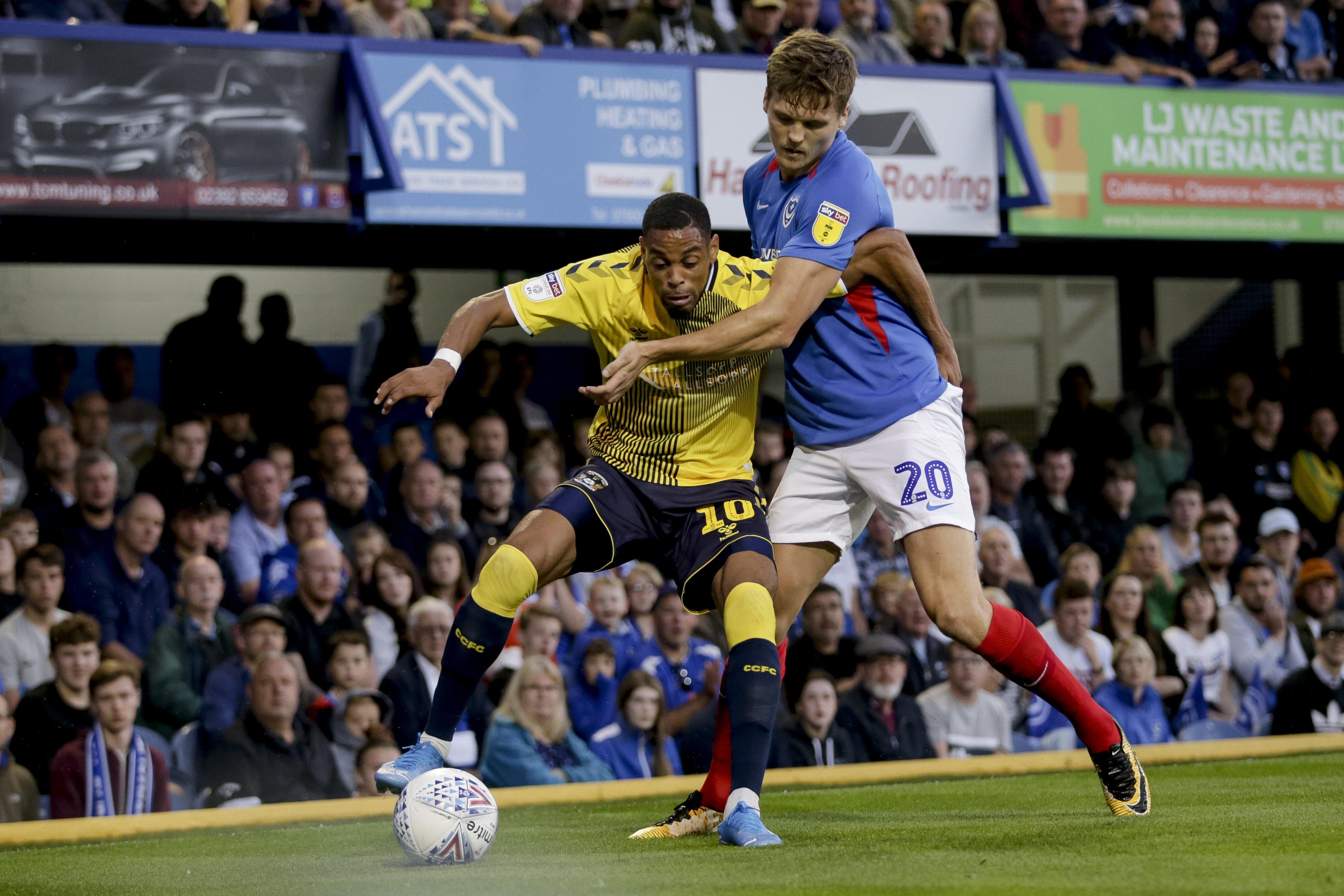 Sean Raggett battles Wesley Jobello for the ball during Pompey's 3-3 draw with Coventry in August. Picture: Robin Jones