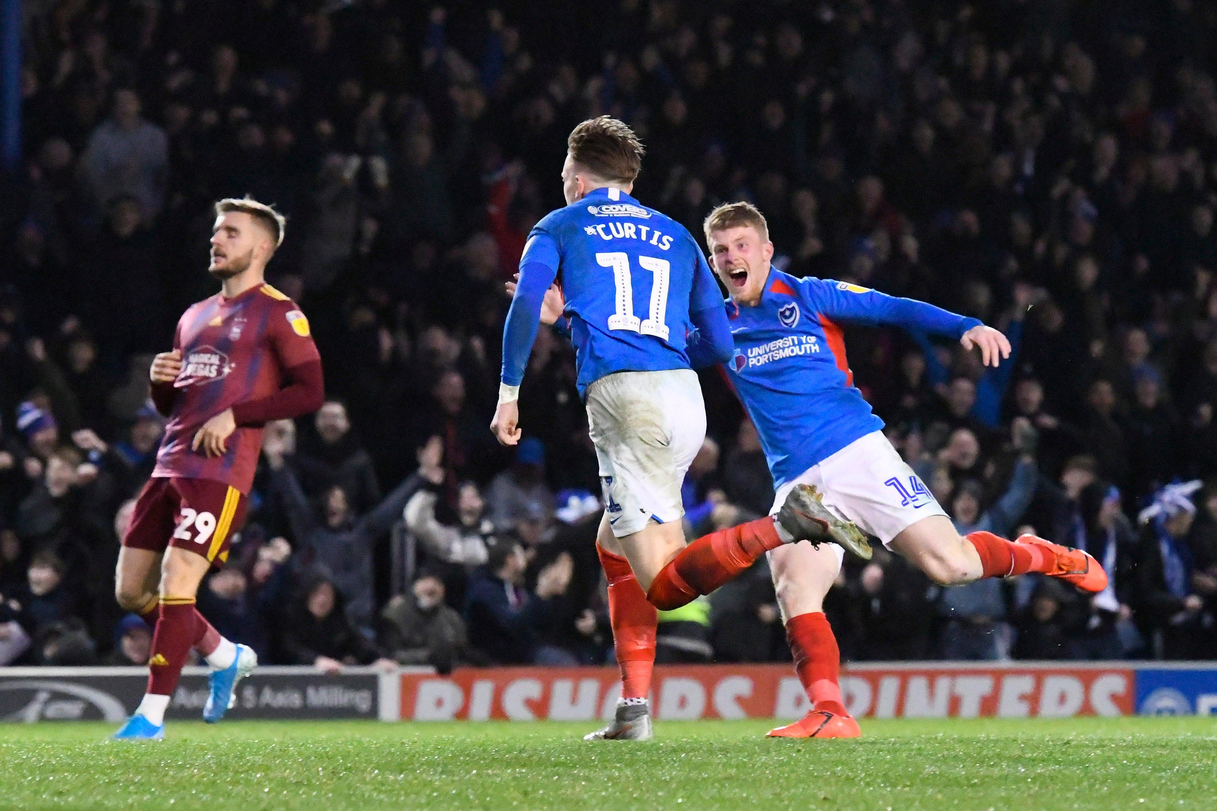 Andy Cannon celebrates with Ronan Curtis after his match-winner against Ipswich. Picture: Graham Hunt