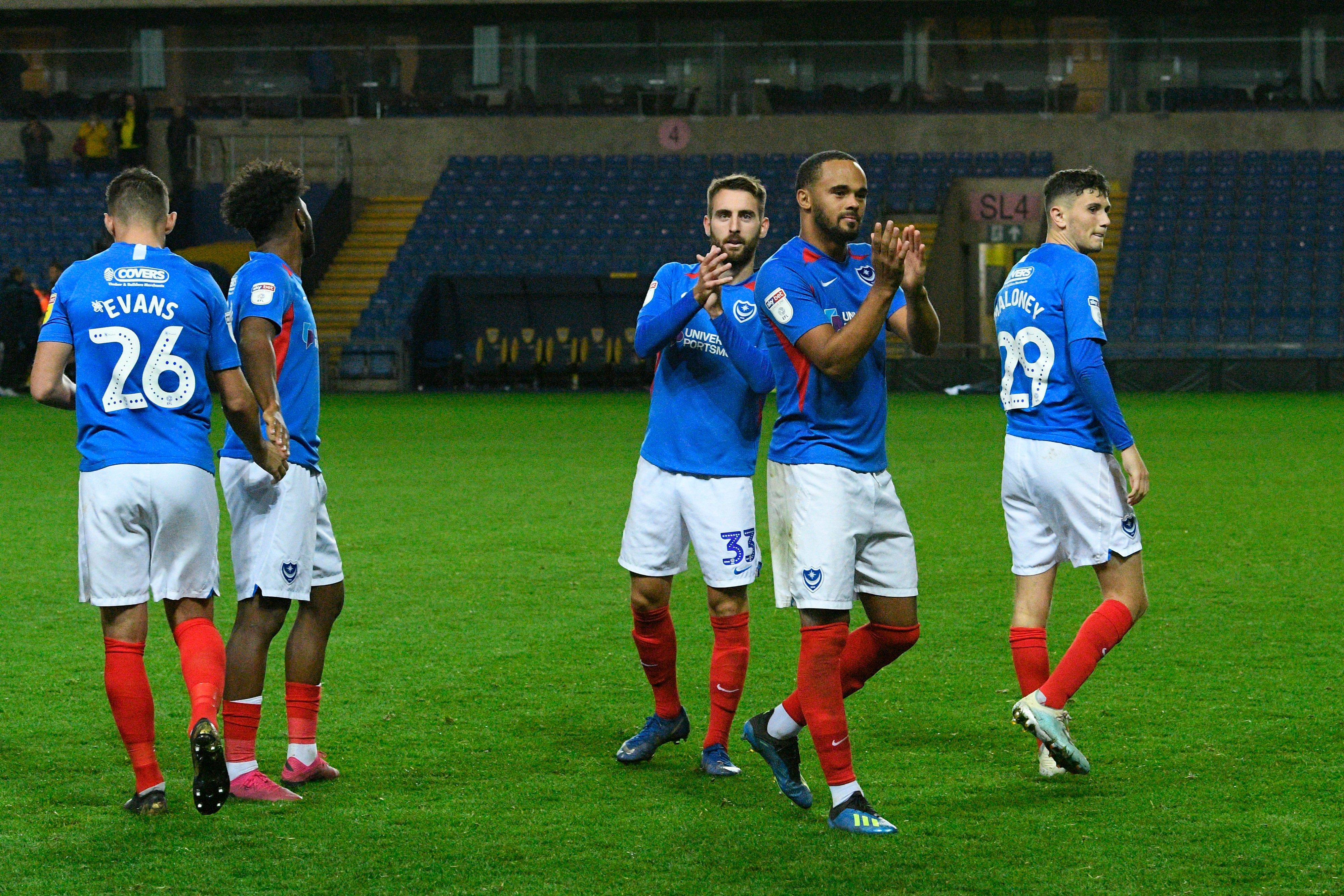 Portsmouth players including Ellis Harrison and Ben Close applauds the fans after the the team won the penalty shoot out at full time during the Leasing.com EFL Trophy match between Oxford United and Portsmouth at the Kassam Stadium, Oxford, England on 8 October 2019.