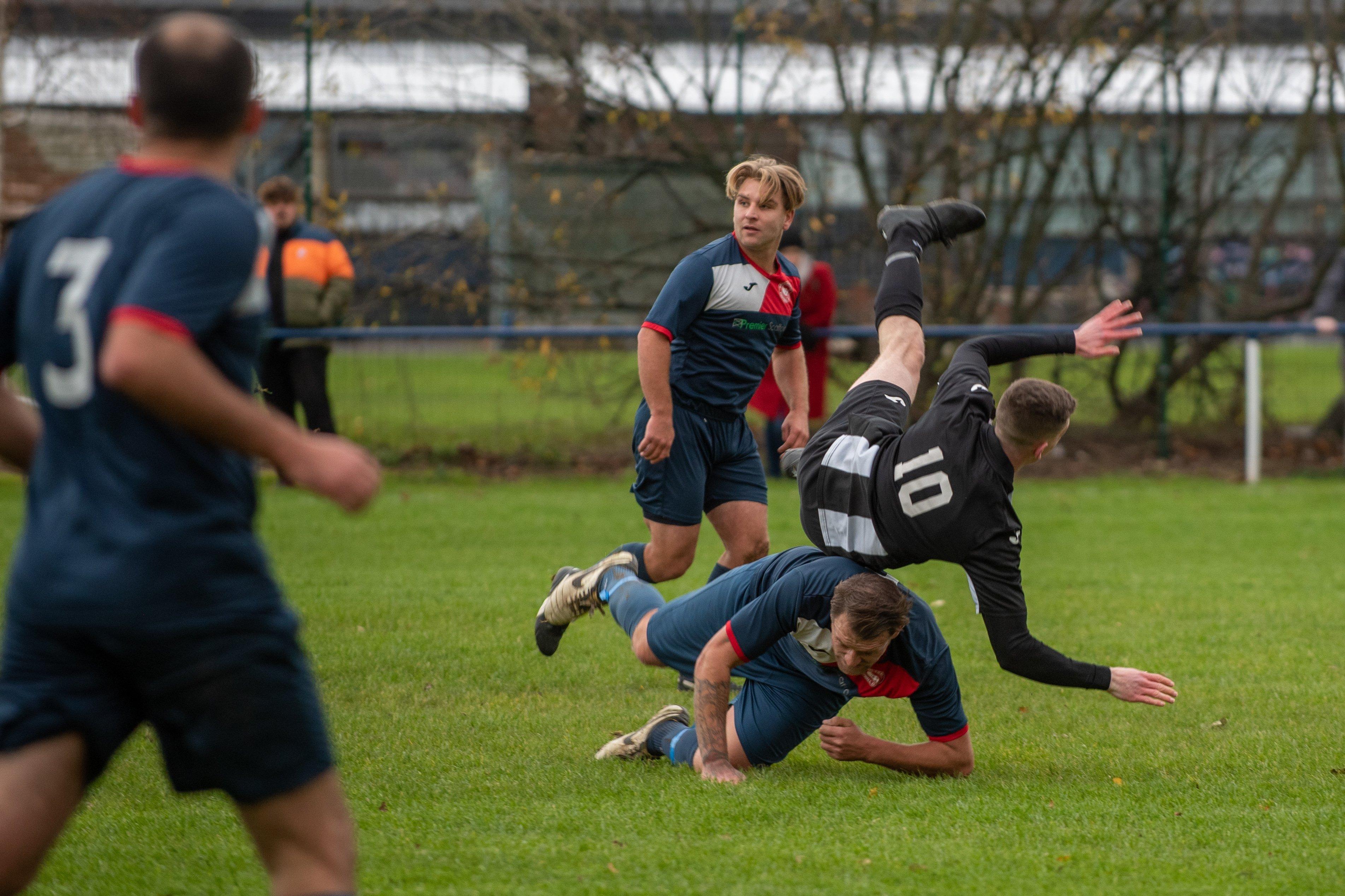 Hayling's George Rough is upended by Paulsgrove's Jake Warlow
