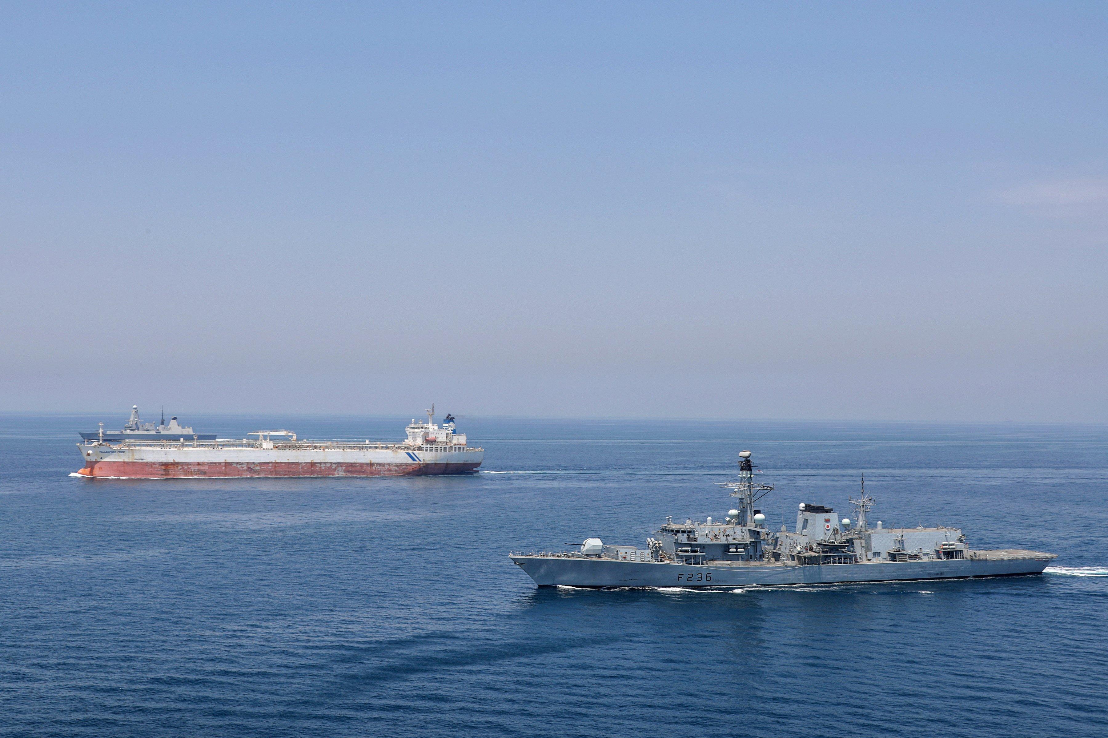 Pictured here is Type 23 Frigate HMS Montrose (front) and Type 45 destroyer HMS DUNCAN (rear) escorting the Tanker Hellespont Pride through international shipping lanes in the Gulf. Photo: LPhot Rory Arnold