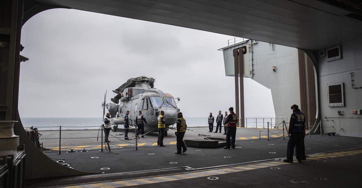 When the Merlins are not in use they are stowed in HMS Queen Elizabeth's large hangar. HMS Queen Elizabeth sailed from Portsmouth on 24th January for a shakedown and training period in UK waters. Picture: Belinda Alker/Royal Navy