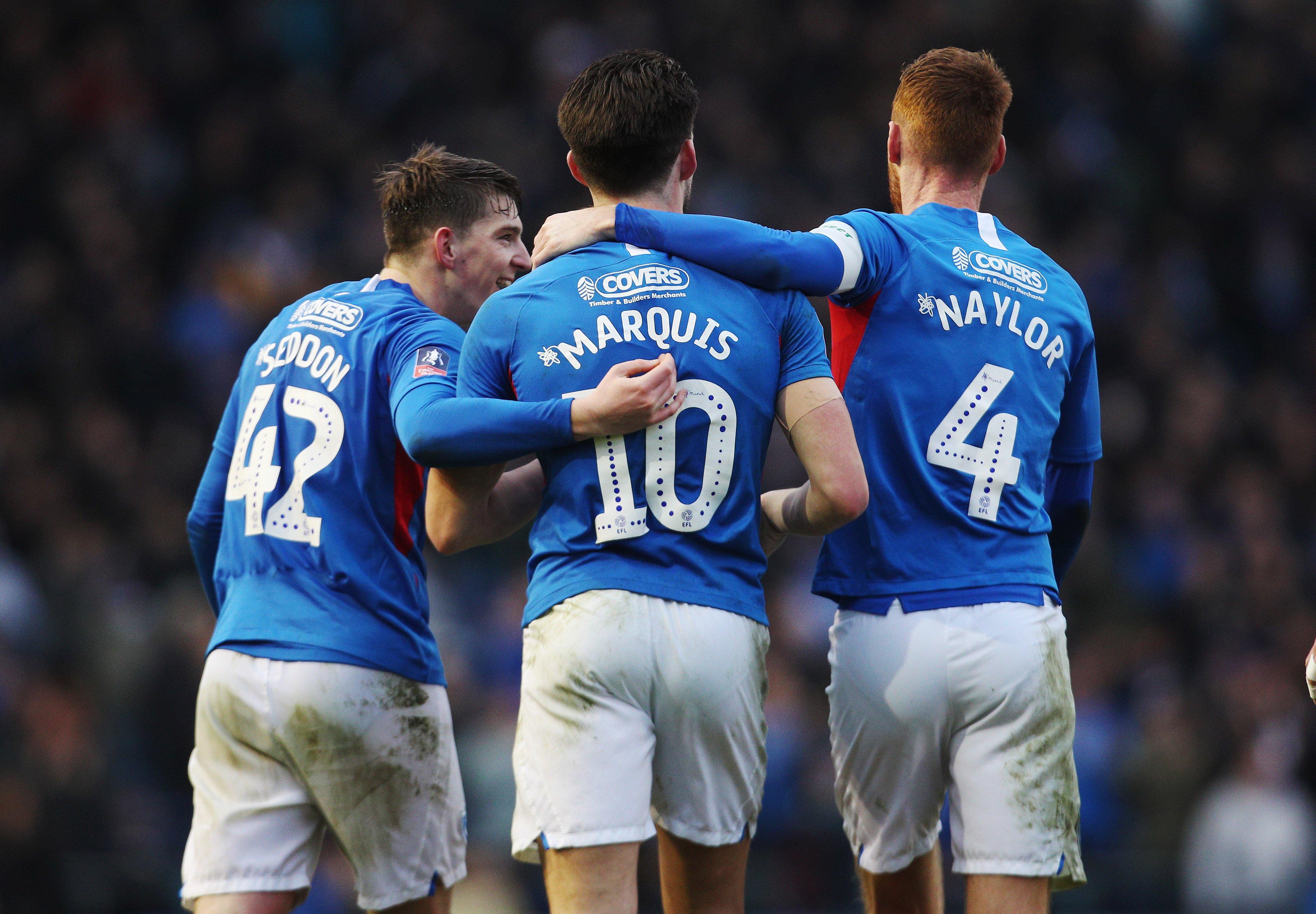 Steve Seddon, John Marquis and Tom Naylor celebrate Pompey's fourth-round win against Barnsley.