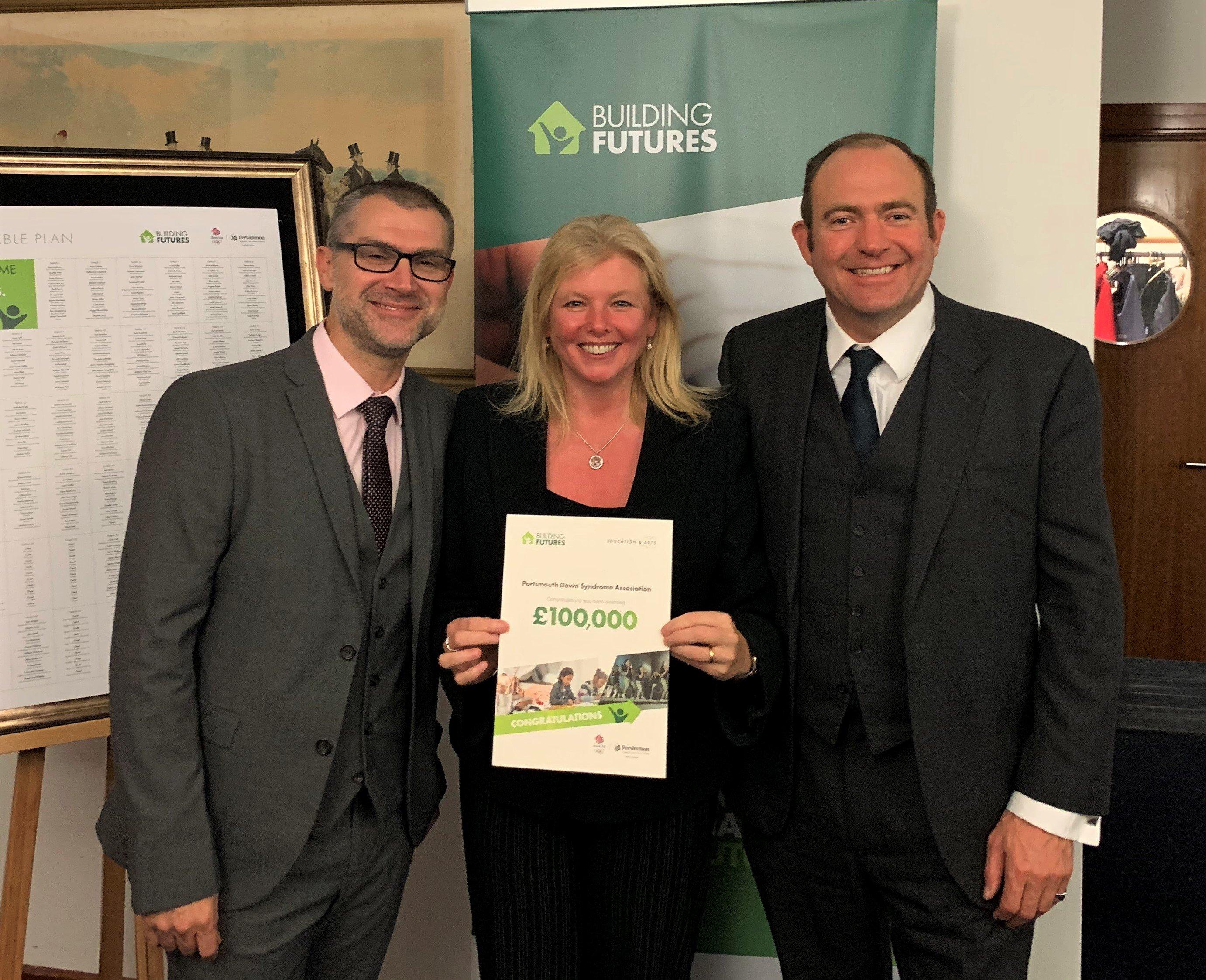 Portsmouth Down Syndrome Association founder Rachael Ross MBE, centre, with representatives from Persimmon Homes after the charity won £100,000 in the developer's Building Futures campaign. 
