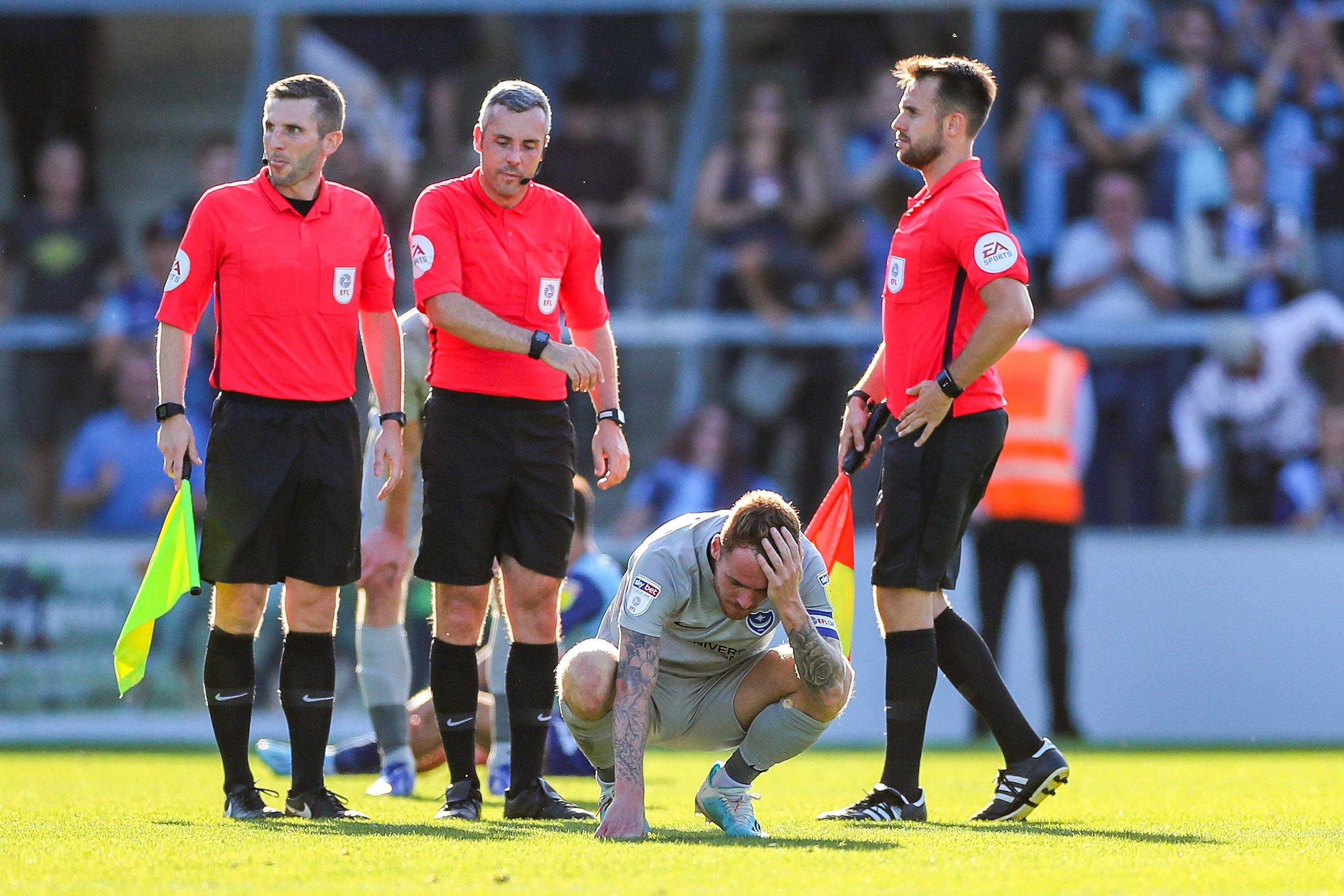 Pompey captain Tom Naylor (4) after defeat at Wycombe    Picture: Nigel Keene