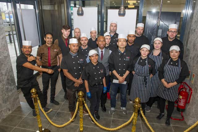 Staff ready to welcome their first customers.
Picture: Habibur Rahman