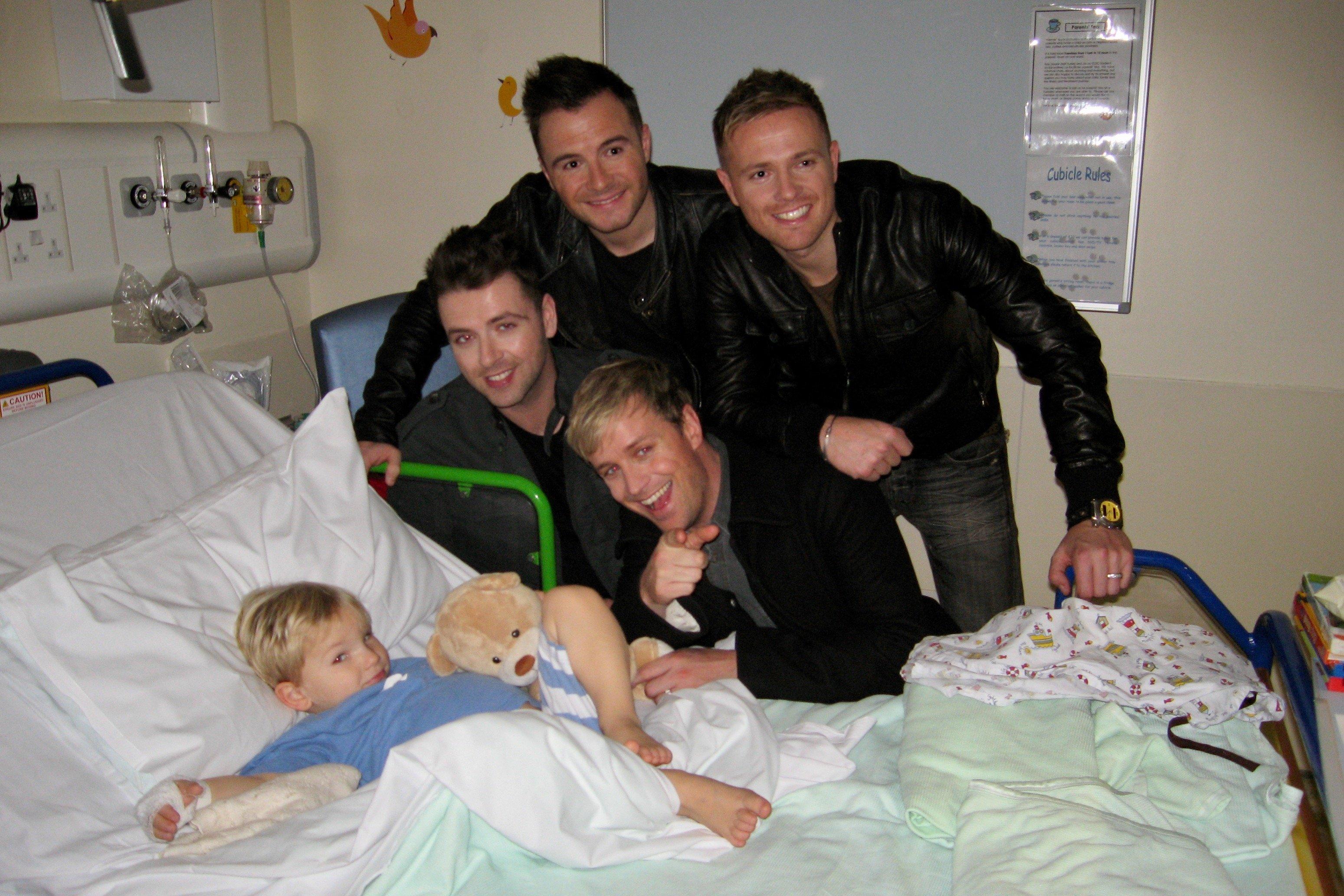 Eddie Hall with Westlife in Great Ormond Street Hospital in 2010