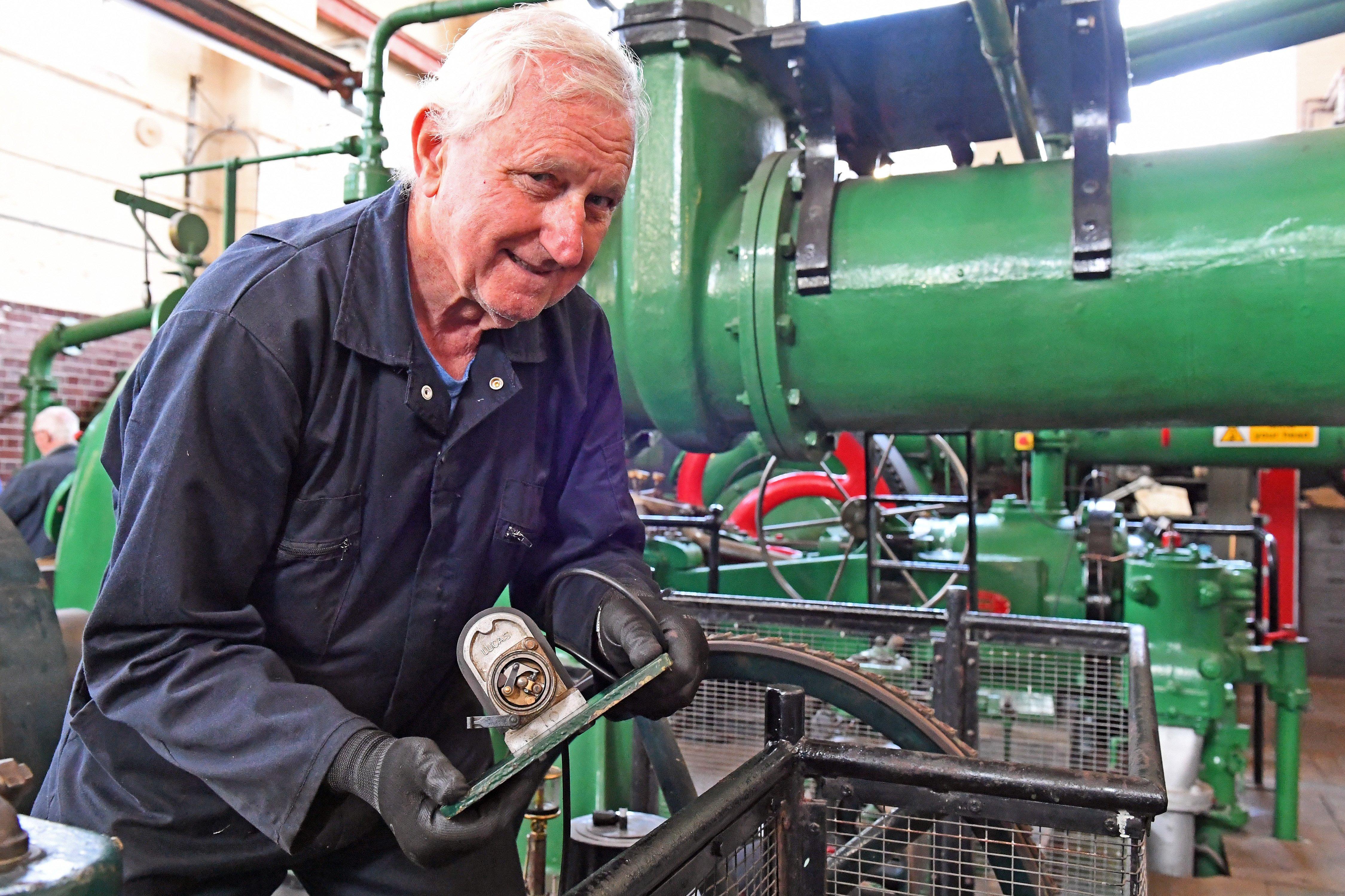 Mike Candy removes a magneto for repair at Eastney Gas Engine House
Picture: Malcolm Wells (190821-6505)