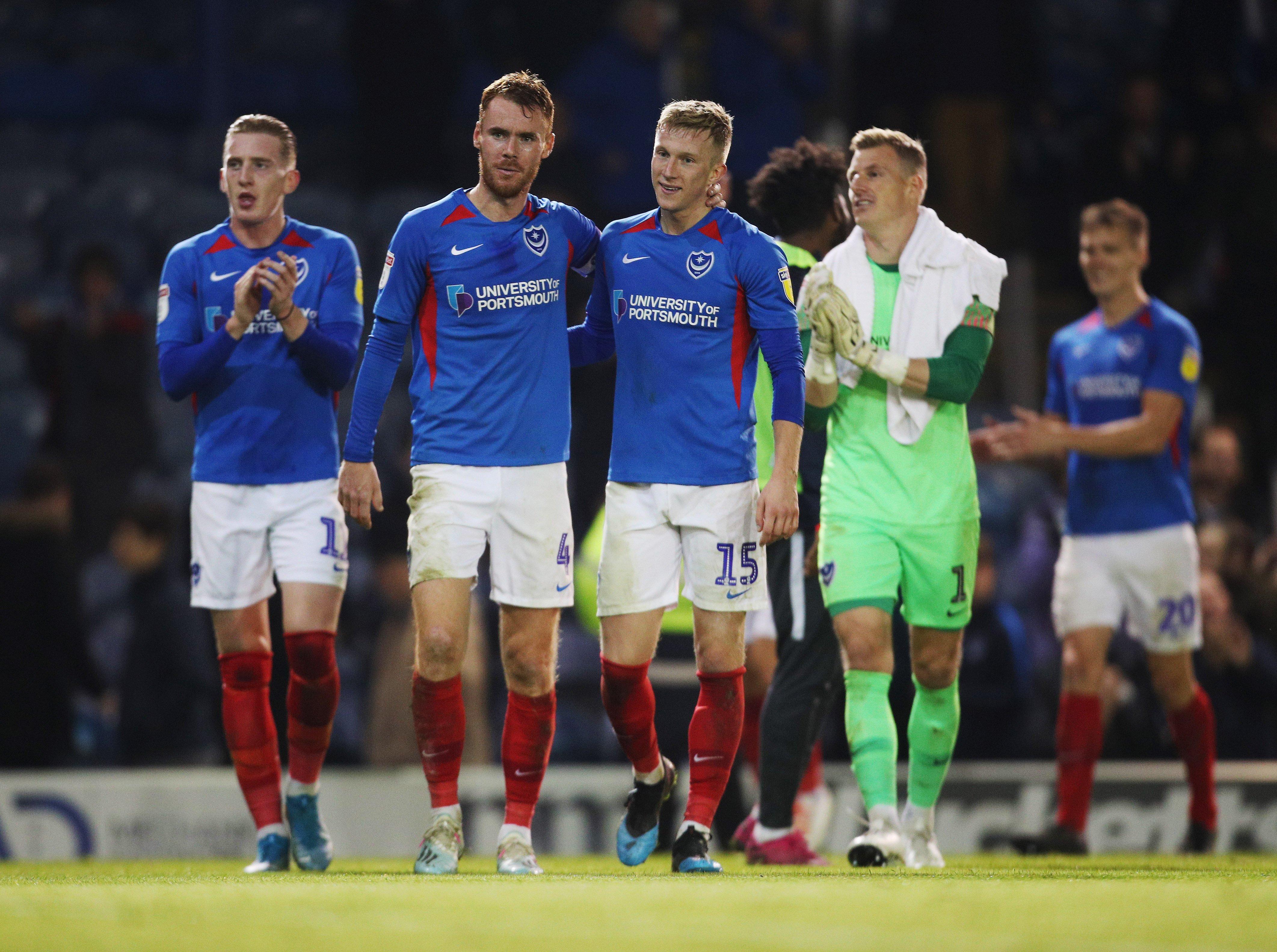 Ross McCrorie, right centre, was brought into the Pompey defensive line-up for the midweek win against Lincoln     Picture: Joe Pepler