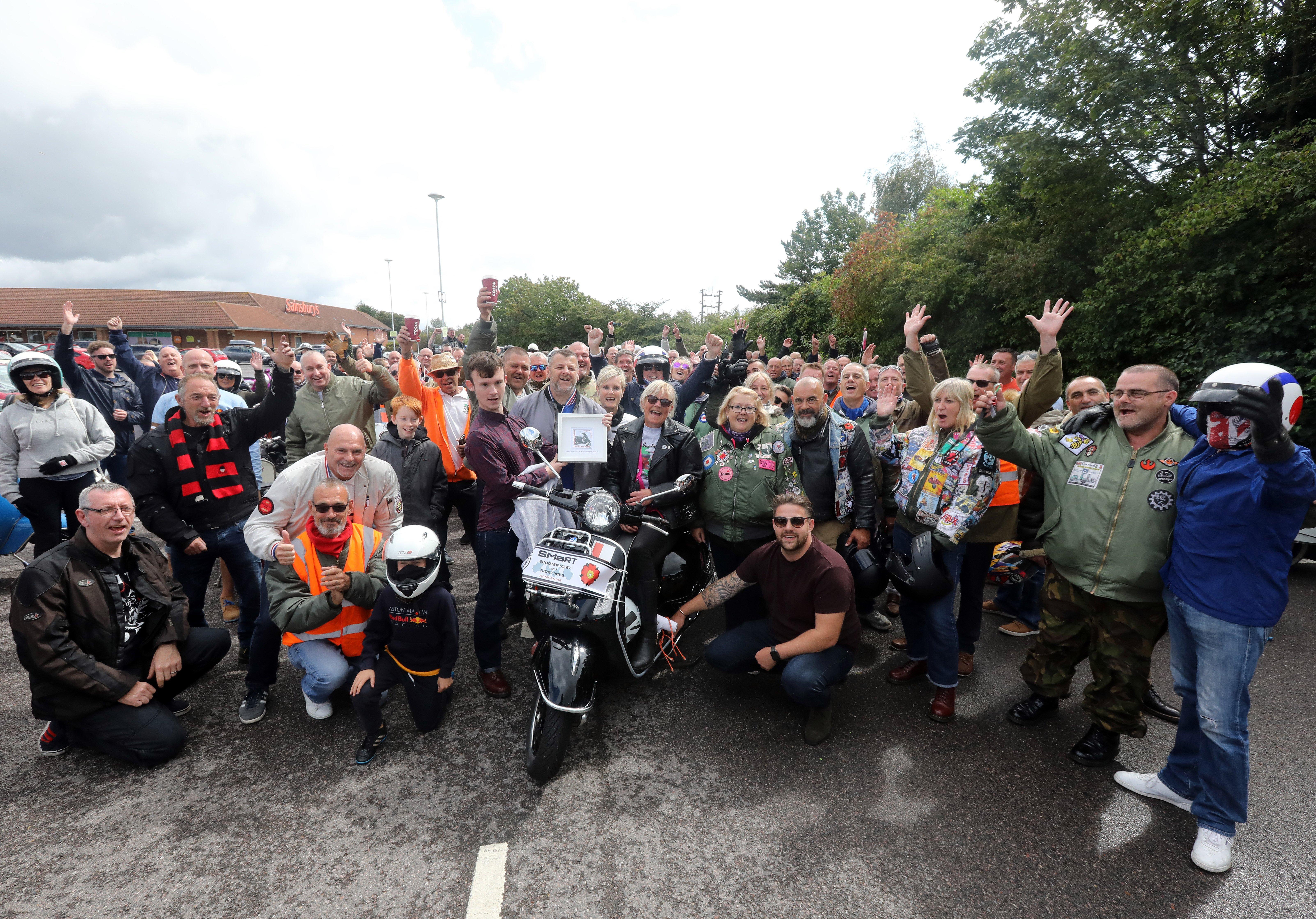 Lorraine Marshall aboard her scooter, and fellow riders. Vespa rally for Lorraine Marshall of Eastney, who is terminally ill. Pictured at Sainbury's Farlington.
Picture: Chris Moorhouse (180819-21)