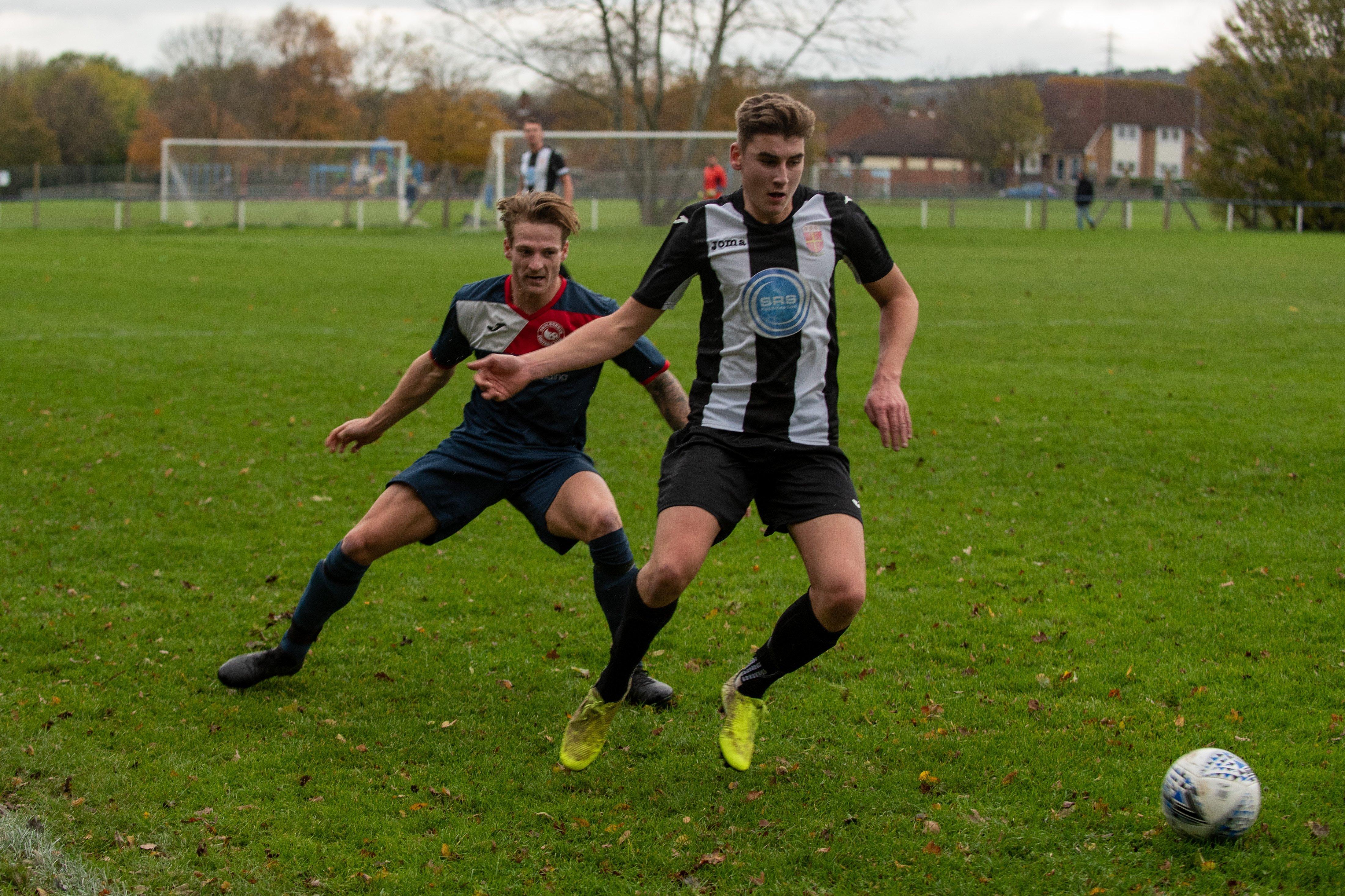 Paulsgrove's Reece Lewis and Hayling's Ben Metherell