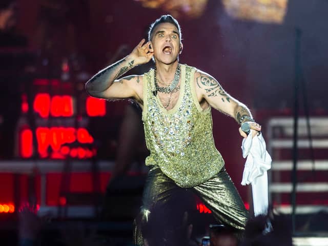 Robbie Williams is set for his only UK performance in 2024 as he headlines BST Hyde Park in July 2024. Are there still tickets to see the former Take That great in London though? (Credit: Tim Kildeborg Jensen / Ritzau Scanpix / AFP)