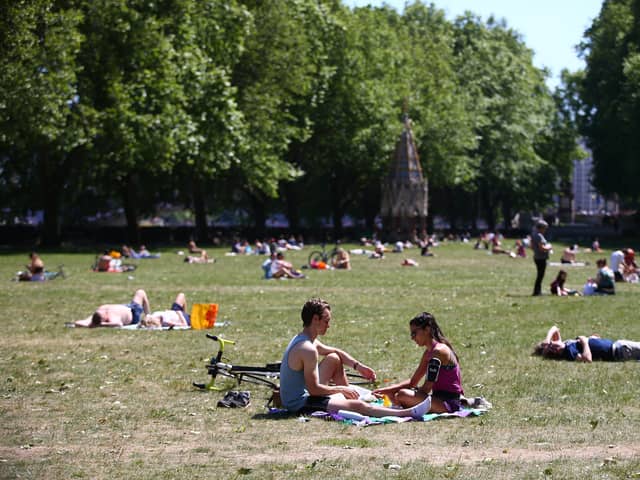 People enjoying warm weather during a heatwave in London. (Photo: Hollie Adams/Getty Images)
