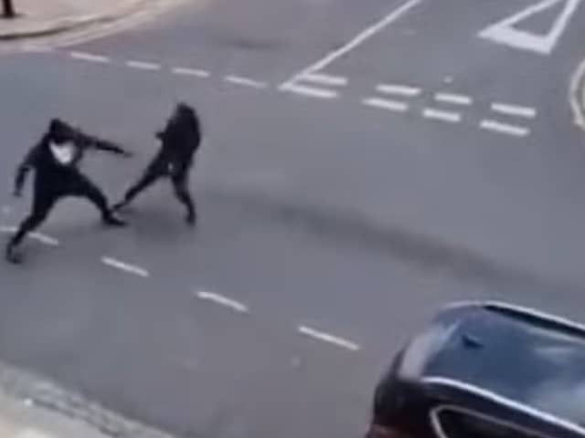 Two men seen fighting with Rambo knives on Cadoxton Avenue in Tottenham
