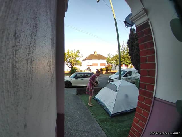 Video grab of the moment a mum was baffled when she looked outside and found a stranger had pitched a tent in her front garden overnight