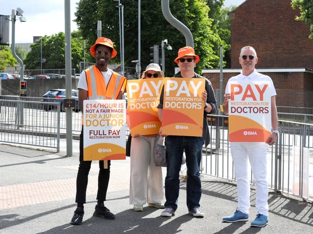 Junior doctors strike at the picket line outside Queen Alexandra Hospital: (left to right)Dr Raymond Effah, Penny Foskett, supporter, Jon Woods and Frank Minal, BMA industrial relations officer.

