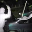Nathan Smith, 33, has been jailed for 5 years. Here he is smashing the windscreen of a vehicle, while wearing a balaclava, gloves and brandishing a machete.