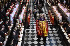 Soldiers of The Queen’s Company of the Grenadier Guards carry the coffin of Queen Elizabeth II