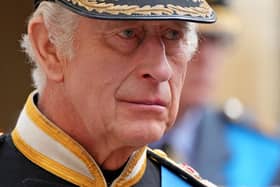 King Charles III follows the coffin of Queen Elizabeth II as it travels inside Windsor Castle on September 19. 