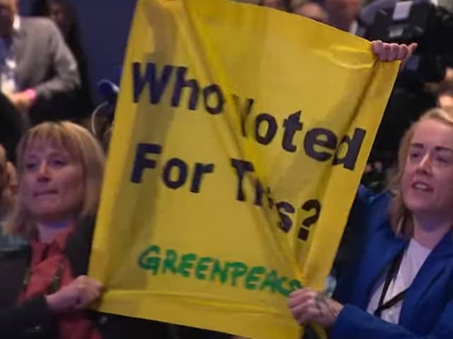 Protestors heckle Prime Minister Liz Truss during her keynote speech at the Conservative Party Conference 2022 in Birmingham.