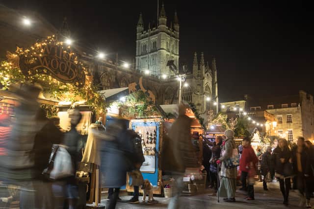 Christmas shoppers browse stalls at the traditional Christmas market in Bath.