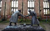 A resin model of a sculpture illustrating the WW1 Christmas Truce football match is pictured during a photocall inside the remains of St Luke's Church in Liverpool