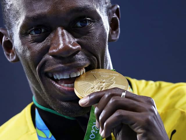 Gold medalist Usain Bolt of Jamaica stands on the podium during the medal ceremony for the Men’s 4 x 100 meter Relay on Day 15 of the Rio 2016 Olympic Games at the Olympic Stadium on August 20, 2016 in Rio de Janeiro, Brazil.  (Photo by Patrick Smith/Getty Images)