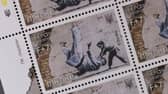 Ukraine postage stamps depicting a Banksy mural