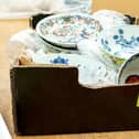 The cardboard box containing a collection of dishes including Chinese ceramics which sold for a total of £112,000.  