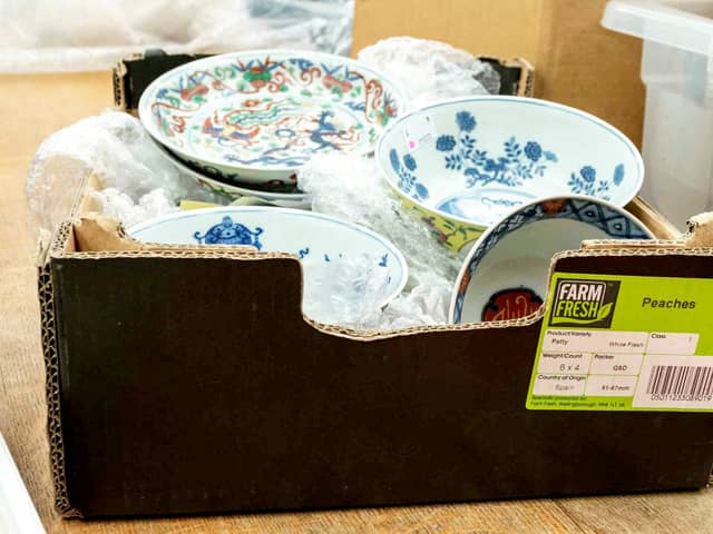 The cardboard box containing a collection of dishes including Chinese ceramics which sold for a total of £112,000.  