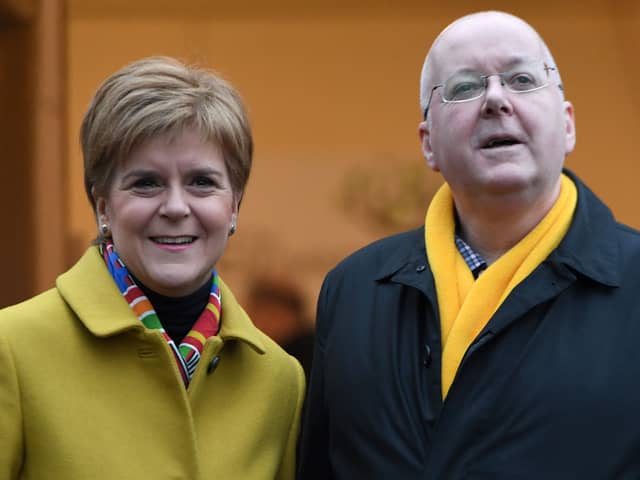 Former First Minister for Scotland and former leader of the Scottish National Party (SNP), Nicola Sturgeon, stands with her husband husband Peter Murrell.   (Photo by ANDY BUCHANAN / AFP) (Photo by ANDY BUCHANAN/AFP via Getty Images)