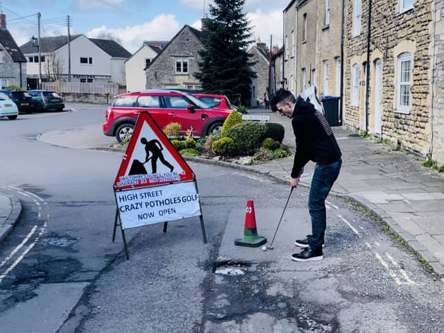 Ben Thornbury demonstrating 'crazy pothole golf' in Malmesbury