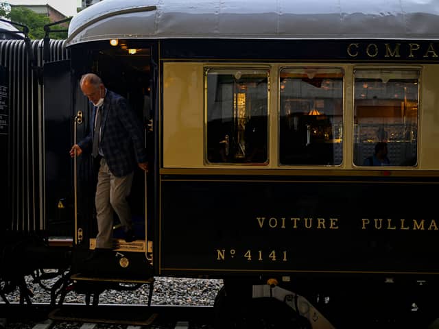 A man disembarks from the Venice Simplon-Orient-Express after arriving at Istanbul Station in Istanbul (Photo by YASIN AKGUL/AFP via Getty Images)