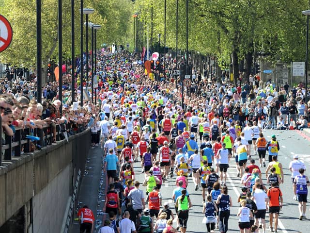 Spectators line the streets at Blackfriars to watch Marathon runners
