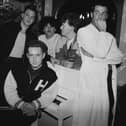 Frankie Goes To Hollywood in 1986. Singer Holly Johnson is seated by the piano, and behind him are (left to right) bassist Mark O’Toole, drummer Peter Gill, guitarist Brian Nash and singer Paul Rutherford. 