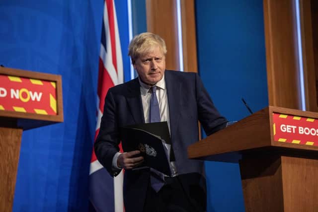 Boris Johnson to stick with ‘Plan B’ Covid measures despite mounting pressures (Photo by JACK HILL/POOL/AFP via Getty Images)