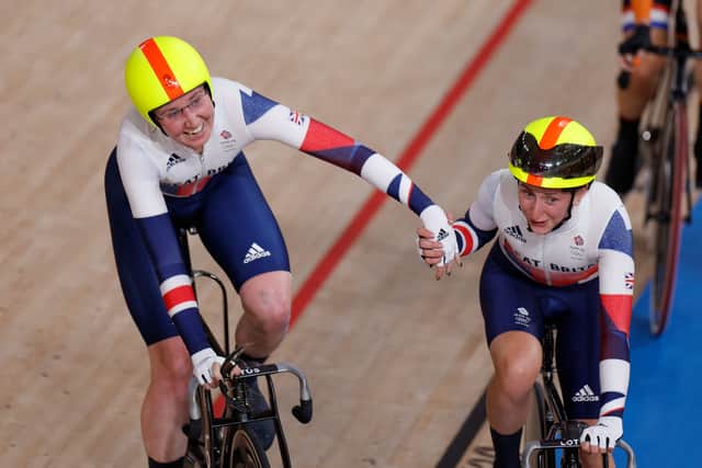 Britain's Katie Archibald (L) and Laura Kenny celebrate after winning in the women's track cycling Madison final (Photo by ODD ANDERSEN/AFP via Getty Images)