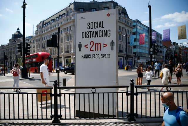 Social distancing and face mask rules could be re-imposed if hospitalisations surge (Photo: Getty Images)