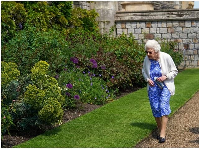 Queen Elizabeth II views a border in the gardens of Windsor Castle, where she received a Duke of Edinburgh rose, given to her by the Royal Horticultural Society (Photo by Steve Parsons - WPA Pool/Getty Images)