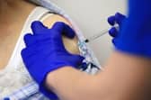 Mixing vaccines can results in an increase of symptoms including chills and a fever (Getty Images)