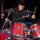 Alex Oxlade-Chamberlain accompanying Liverpool Lighthouse combined choirs, Love & Joy Gospel Choir & Lighthouse Choir, on drums. Image: Brian Roberts