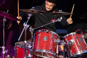 Alex Oxlade-Chamberlain accompanying Liverpool Lighthouse combined choirs, Love & Joy Gospel Choir & Lighthouse Choir, on drums. Image: Brian Roberts