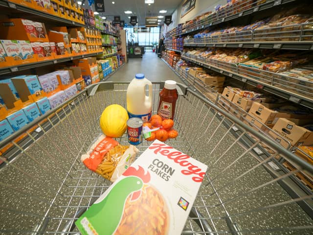 A shopping trolley filled with groceries from Aldi, which has been named the UK’s cheapest supermarket for 12 months in a row.