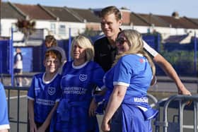 Sean Raggett poses for a photo with supporters ahead of kick-off with Exeter City on Tuesday night. (Image: Jason Brown/ProSports Images)
