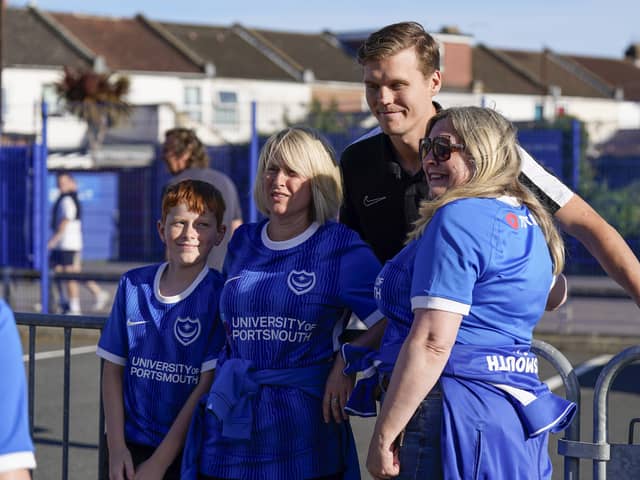 Sean Raggett poses for a photo with supporters ahead of kick-off with Exeter City on Tuesday night. (Image: Jason Brown/ProSports Images)
