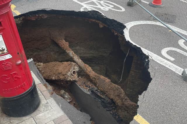 A mysterious sinkhole the size of a car has appeared on a UK street