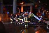 Firefighters work on the site of a bus accident on 3 October in Mestre, near Venice (Photo: MARCO SABADIN/AFP via Getty Images)